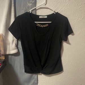 I am selling this black shirt. It is a size medium it has a tie in the front.